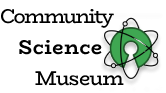 A logo for The Community Science Museum. The logo itself consist of a drawing of an atom.